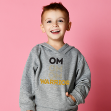 Load image into Gallery viewer, Proud to be an OM Warrior. Your littles will be cozy and stay balanced in our OM Warrior Kids Hoodie. This will be your young warrior's new favorite hoodie, featuring a front "OM OM OM WARRIOR" graphic printed with eco-friendly inks, premium stitch details, lined hoodie, a kangaroo pocket and rib cuffs and hem band. Plus, to ensure kids' safety, the hoodie comes with no drawcords.