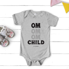 Load image into Gallery viewer, This super soft OM Child short sleeve one-piece for your tiny warrior features 100% combed and ring-spun cotton, and our classic "OM OM OM CHILD" front graphic printed with eco-friendly inks. The onesie design has has a three snap leg closure for easy changing at the bottom and a envelope neckline for ultimate comfort.