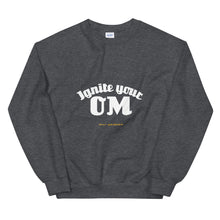 Load image into Gallery viewer, Ignite Your OM Unisex Sweatshirt (Color Dark Heather) - Radiate good energy in our Ignite Your OM Classic Crew Sweatshirt, featuring a rib crewneck, raglan sleeves, and 'Ignite Your OM' front graphic printed with eco-friendly inks. Relaxed, slightly oversized fit. Made with 50% cotton and 50% polyester for ultimate coziness.