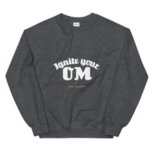 Load image into Gallery viewer, Ignite Your OM Unisex Sweatshirt (Color Dark Heather) - Radiate good energy in our Ignite Your OM Classic Crew Sweatshirt, featuring a rib crewneck, raglan sleeves, and &#39;Ignite Your OM&#39; front graphic printed with eco-friendly inks. Relaxed, slightly oversized fit. Made with 50% cotton and 50% polyester for ultimate coziness.
